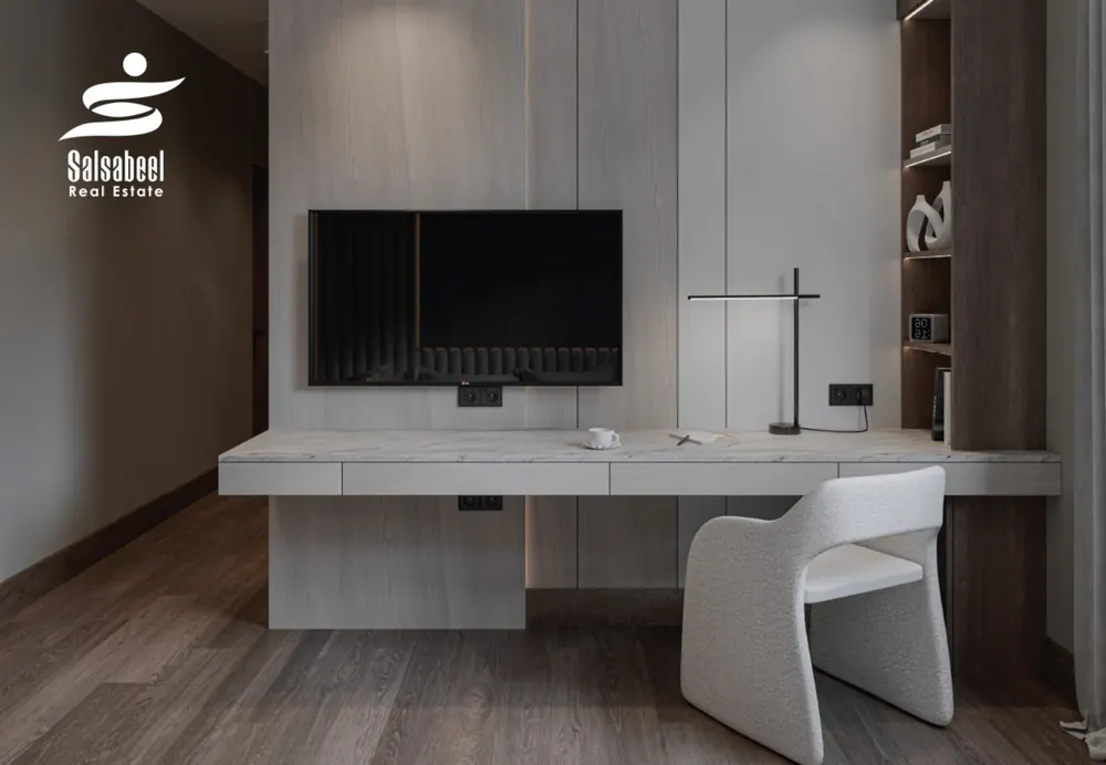 Illustrative interior render of a room with a built-in desk and wall-mounted TV